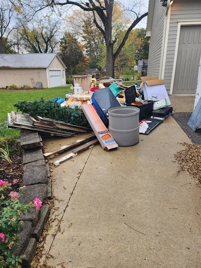 Dumpster being loaded with debris for Commercial Dumpster Rental in Seminole